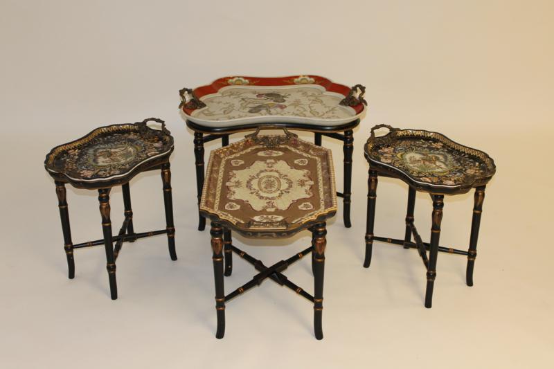 Four Ebonised and Gilt Tea Tables